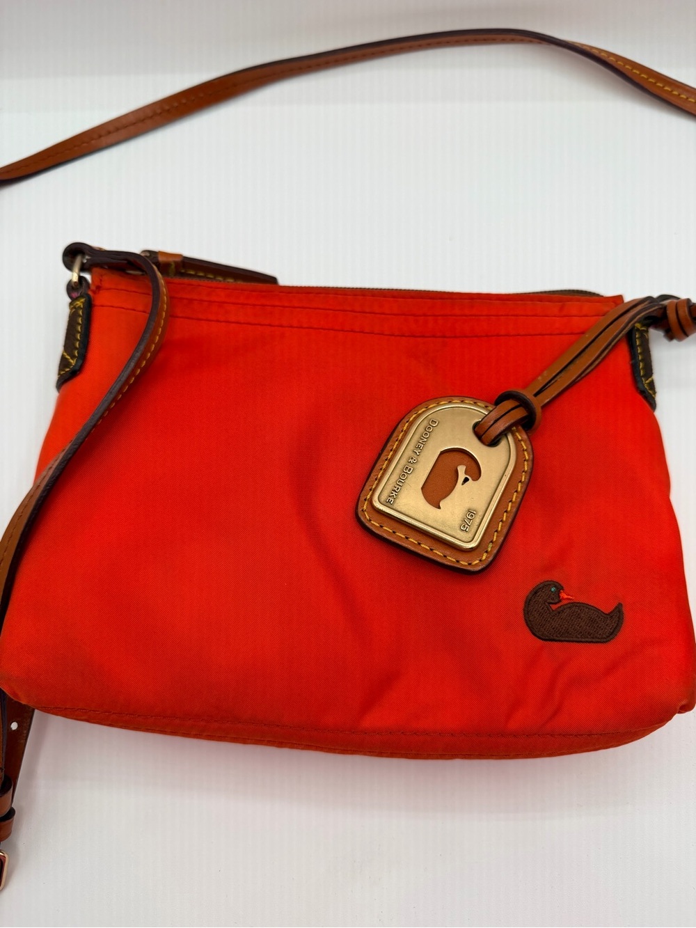 Dooney & Bourke Orange Duck Logo Small crossbody Bag Zip Top Inner Pockets